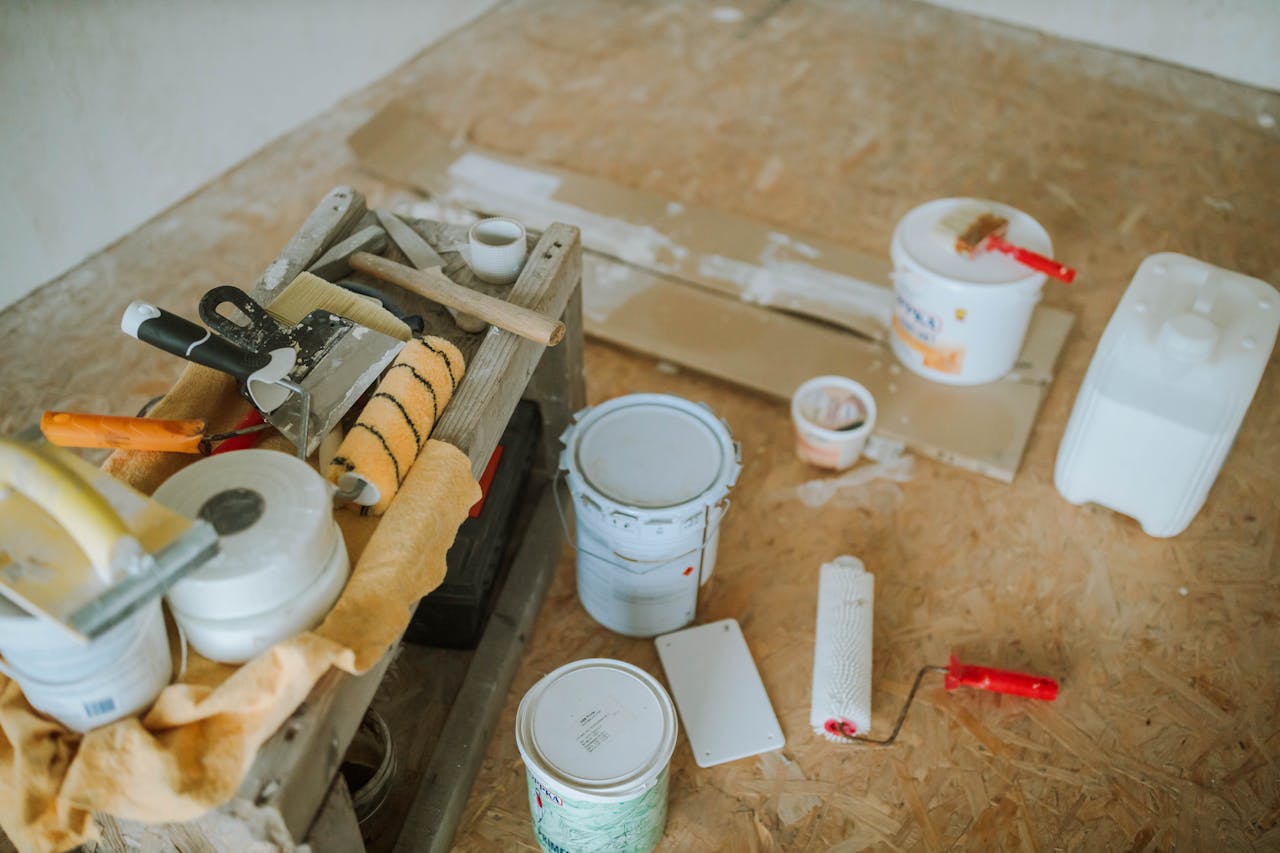 The Art of Drawing Readers In: Your attractive post title goes here Overhead shot of tools and paint supplies for a home renovation project.